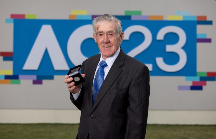 Ken Rosewall with the Australian Open 2023 coin. Picture: Tennis Australia Ken Rosewall with the Australian Open 2023 coin. Picture: Tennis Australia
