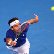 Marinko Matosevic of Australia plays a forehand in his singles match against  Andy Murray of Great Britainduring day six of the 2015 Hopman Cup at Perth Arena on January 9, 2015 in Perth, Australia.  (Photo by Paul Kane/Getty Images)