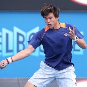 MELBOURNE, AUSTRALIA - JANUARY 29:  Akira Santillan of Australia in action in his match against Duck Hee Lee of Korea during the Australian Open 2015 Junior Championships at Melbourne Park on January 29, 2015 in Melbourne, Australia.  (Photo by Patrick Scala/Getty Images)