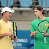 Alex de Minaur (R) talks to Australian Davis Cup team orange boy Charlie Camus (L) during a practice session ahead of the Davis Cup Qualifier between Australia and Hungary at Ken Rosewall Arena in Sydney, Australia. (Photo by Matt King/Getty Images)