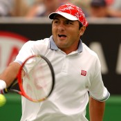 Andrew Ilie in action during the 2003 Australian Open at Melbourne Park. (Photo by Nick Laham/Getty Images).