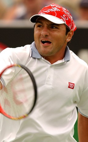 Andrew Ilie in action during the 2003 Australian Open at Melbourne Park. (Photo by Nick Laham/Getty Images).