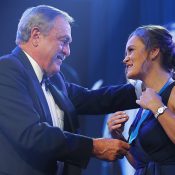 Ash Barty (R) is presented with the 2019 Newcombe Medal by John Newcombe. (Getty Images)