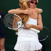 Anastasia Rodionova (R) embraces Alla Kudryavtseva of Russia after winning their first round match against Yanina Wickmayer and Shuai Zhang; Getty Images