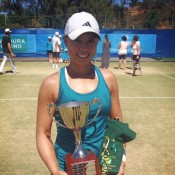 Alison Bai holds the trophy after winning the women's singles title at the Mildura Grand International