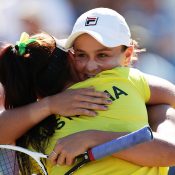 Ash Barty (R) and Casey Dellacqua embrace after winning their doubles rubber to seal a 3-2 victory for Australia in Fed Cup against Ukraine in Canberra; Getty Images