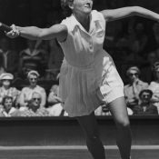 Australian tennis player Beryl (Penrose) Collier seen competing against Louise Brough in the 1955 Wimbledon quarterfinals; Getty Images