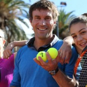 Pat Cash at the Gallipoli Youth Cup media event at Melbourne Park with 2012 tournament champion Ellen Perez (L) and Sera Yavuzcan (R); Tennis Australia