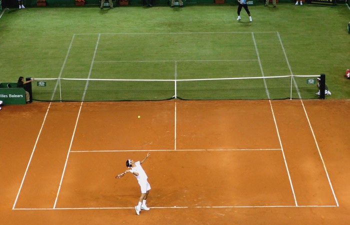 Roger Federer and Rafael Nadal play on a half clay, half grass court. GETTY IMAGES