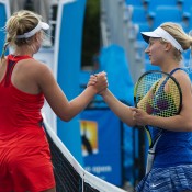 Daria Gavrilova (R) shakes hands with Abbie Myers after winning their Australian Open 2015 Play-off quarterfinal; Elizabeth Xue Bai