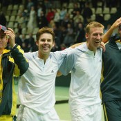 Wayne Arthurs (second from right) and Todd Woodbridge (second from left) of Australia celebrate their win with teammates Mark Philippoussis (R) and Lleyton Hewitt in the 2003 Davis Cup quarterfinals over Sweden in Malmo, Sweden; Getty Images