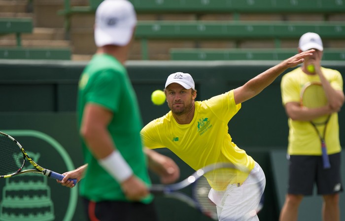 Aussies prepare at Kooyong Hitting partner Matt Reid in action as Lleyton Hewitt watches on; Elizabeth Xue Bai