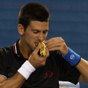 Novak Djokovic Novak Djokovic eats a banana during Australian Open 2012; Getty Images