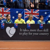 The Australian Fed Cup team of (L-R) team manager Fi Luscombe, orange girl Kimberly Birrell, Sam Stosur and Olivia Rogowska watch from the sidelines during the Netherlands v Australia Fed Cup World Group Play-off tie in 's-Hertogenbosch; Henk Koster