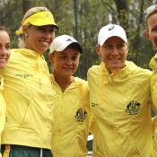 (L-R) Jarmila Gajdosova, captain Alicia Molik, Ashleigh Barty, Sam Stosur and coach Nicole Bradtke of Australia celebrate their Fed Cup victory over Switzerland in Chiasso, Switzerland; Getty Images