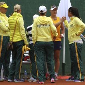 Sam Stosur (second from right) celebrates her opening singles rubber victory over Stefanie Voegele with teammates at the end of the match; Getty Images