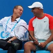 Andrew Florent (R) shares a laugh with Lleyton Hewitt during the Australian Open 2014 legends event; Getty Images