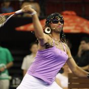 Ever the entertainer, Andrew Florent channels Serena Williams at the Gerard McCabe Jewellers Celebrity Tennis Challenge at the Adelaide Entertainment Centre in December 2007; Getty Images