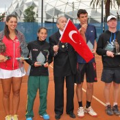Gallipoli Youth Cup finalists (L-R) Ipek Soylu, Seone Mendez, Aleksandar Vukic and Mitchell Pritchard pose with veteran Turgut Kacmaz at Melbourne Park's National Tennis Centre; Tennis Australia