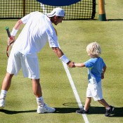 Lleyton Hewitt is joined on court by son Cruz after beating Juan Martin del Potro of Argentina at the AEGON Championships at Queen's Club; Getty Images