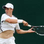 Andrew Harris of Australia in action during his Boys' Singles first round match against Enzo Couacaud of France on day seven of the Wimbledon Lawn Tennis Championships at the All England Lawn Tennis and Croquet Club on July 2, 2012 in London, England.  (Photo by Julian Finney/Getty Images)