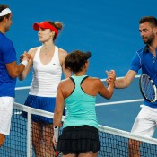 Marinko Matosevic and Casey Dellacqua of Australia congratulate Alize Cornet and Benoit Paire of France after France won the mixed doubles match during day four of the 2015 Hopman Cup at Perth Arena on January 7, 2015 in Perth, Australia.  (Photo by Will Russell/Getty Images)