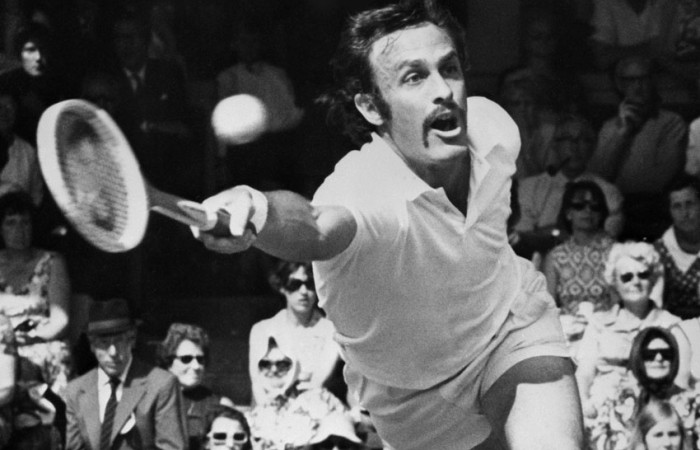 John Newcombe John Newcombe in action at Wimbledon; Getty Images
