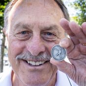 John Newcombe is celebrated on the AO 2025 match coin.