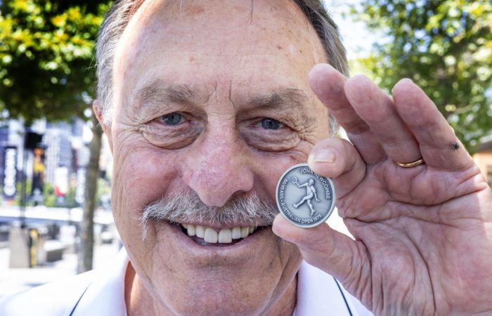 John-Newcombe-and-coin John Newcombe is celebrated on the AO 2025 match coin.