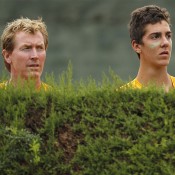 Australia Junior Davis Cup captain Mark Woodforde (L) and Thanasi Kokkinakis keep an intent eye on the action at the world finals in Barcelona; photos Srdjan Stevanovic
