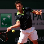 Jay Andrijic, playing a forehand in his boys' singles first round match against Hyeon Chung of Korea, went down 6-3 6-1; Getty Images