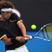 Nick Lindahl plays a backhand in his first round match during day one of the 2010 Australian Open. GETTY IMAGES