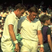 John Newcombe (left) and Tony Roche of Australia discuss tactics during a break in a doubles match at the Wimbledon Championships; Getty Images