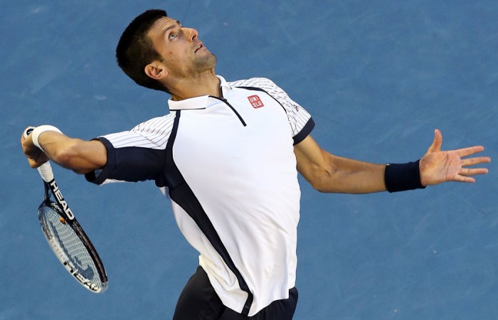 Novak Djokovic Novak Djokovic hits a serve in his quarterfinal match against Tomas Berdych at Australian Open 2013; Getty Images