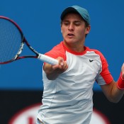 MELBOURNE, AUSTRALIA - JANUARY 19:  Oliver Anderson of Australia plays a backhand in his first round junior boys' match against Rafael Matos of Brazil during day seven of the 2014 Australian Open at Melbourne Park on January 19, 2014 in Melbourne, Australia.  (Photo by Robert Prezioso/Getty Images)