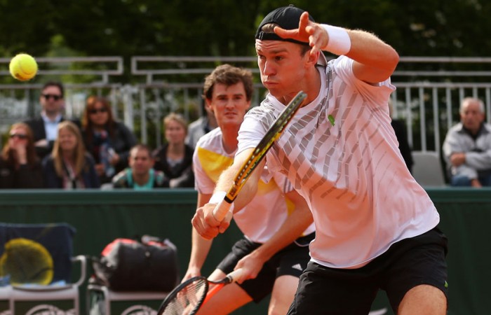 John Peers Jamie Murray John Peers of Australia plays a backhand volley alongside British partner Jamie Murray in their first round doubles win over Julian Knowle of Austria and Filip Polasek of Slovakia on Day 4 of the French Open; Getty Images