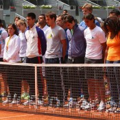 ATP and WTA players in Madrid stand together for a minute's silence to honour Brad Drewett. GETTY IMAGES