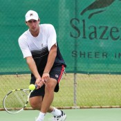 Carsten Ball gets down low for a backhand return. Photo: Rob Hamilton