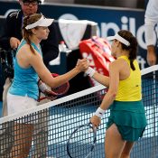 Elena Rybakina (L) shakes hands with Kimberly Birrell after winning the second singles rubber of the Australia v Kazakhstan tie at Pat Rafter Arena