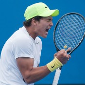 Akira Santillan celebrates his victory over Matt Reid in the first round of the Australian Open Play-off; Elizabeth Xue Bai