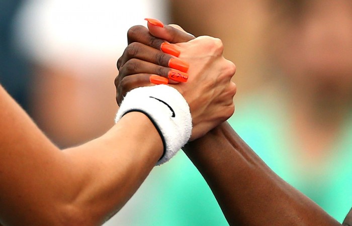 Handshake Sloane Stephens (R) shakes hands with Mandy Minella after winning their 2013 US Open first round match; Getty Images
