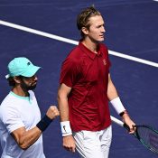 Sebastian Korda (R) and Jordan Thompson celebrate after defeating Brazil's Fernando Romboli and Australia's John-Patrick Smith during the men's doubles semifinals at Indian Wells [Photo: PATRICK T. FALLON/AFP via Getty Images]