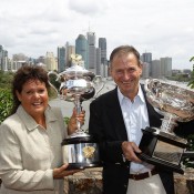 Evonne Goolagong Cawley (left) and Ashley Cooper show off the Australian Open trophies at Brisbane's Kangaroo Point Cliffs. GETTY IMAGES