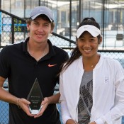 Gavin Van Peperzeel (L)  and Priscilla Hon pose with their trophies after winning the Brisbane men's and women's Pro Tour titles; Tennis Australia