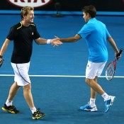 Mark Woodforde (L) and Todd Woodbridge in action during the legend's doubles event at Australian Open 2014; Getty Images